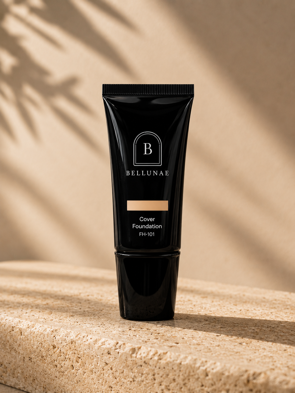 Full Cover Foundation bottle on a travertine ledge